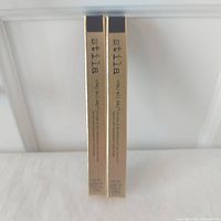 Front view of two boxed Stila eyeliners