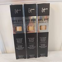 Front view of three boxed concealers