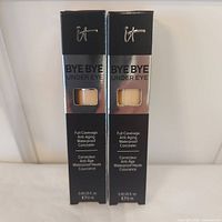Front view of two boxed concealers
