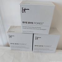 Front view of three sealed powder boxes