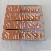 Four Maybelline Sunkisser blush tubes front view