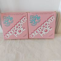 Front view of two boxed palettes showing branding