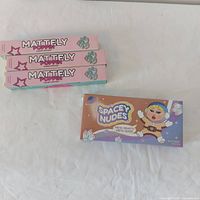 Three boxed Mattely Poppin lipsticks and Spacey Nudes palette