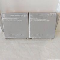 Front view of two boxed r.e.m. beauty Hypernova Satin Matte Bronzers