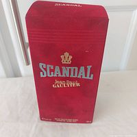 Front of sealed red Scandal box