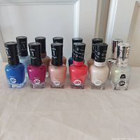 Front row of 10 Step 1 gel polishes and 2 Step 2 top coats