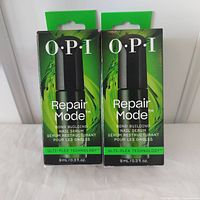 Front view of the two boxed OPI Repair Mode nail serums