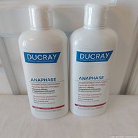 Front view of both sealed 400ml shampoo bottles
