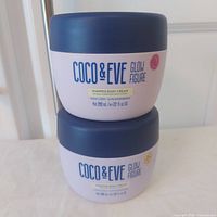 Two Coco & Eve Glow Figure body cream jars stacked front view, labels visible