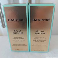 Front view of two sealed Darphin Éclat Sublime serum boxes