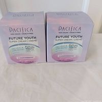 Front view of two sealed Pacifica Future Youth Super Cream boxes
