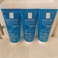 Front view of three sealed La Roche-Posay Effaclar 200 ml tubes