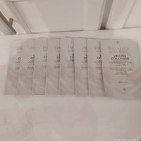 Front view of eight sealed Pacifica Vegan Collagen mask pouches