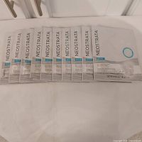 Ten Neostrata Restore Hyaluronic Masks laid out in a row