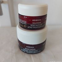 Two Korres Wild Rose jars stacked showing sizes