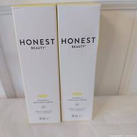 Front view of two sealed Honest Beauty Vitamin C Radiance Serum boxes