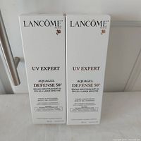 Front view of both boxed Lancome UV Expert Aquagel Defense 50 products