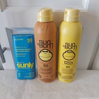 All three sunscreen products side by side