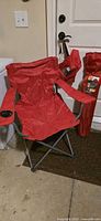 Red Ozark Trail chair opened showing frame and cup holder