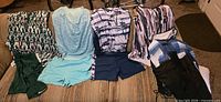 All five two-piece women’s summer sets laid out on couch