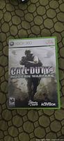 Front cover of Xbox 360 case showing Call of Duty 4: Modern Warfare artwork.