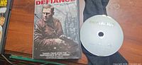 Front cover of Defiance DVD and disc