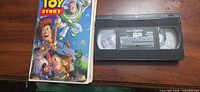 Front view of Toy Story VHS sleeve next to cassette