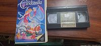Front of Cinderella VHS slipcase beside tape