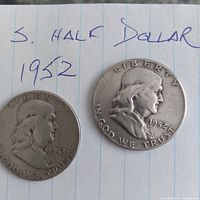 Both 1952 Franklin half dollars obverse visible