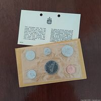 Front view showing six 1968 Canadian coins in sealed RCM cellophane with information card and outer envelope