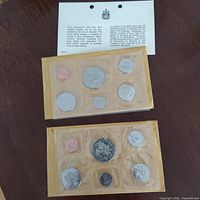 Two sealed 1970 Canadian Mint coin sets with info card visible