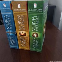 Spine view of all three books showing titles and author