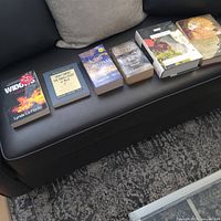 All six books laid out on sofa
