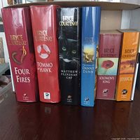 Front view of six Bryce Courtenay books standing upright showing titles and spines