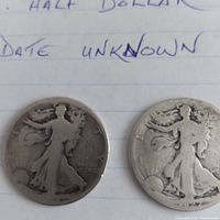 Obverse of two worn Walking Liberty half dollars