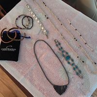 All jewelry pieces laid out on towel for overview