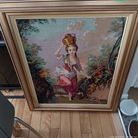 Front view of framed needlepoint artwork showing full scene and frame