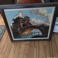 Full front view of framed needlepoint artwork