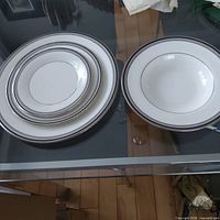Stacked dinner, salad, bread plates and soup bowl showing pattern
