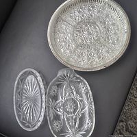 Overview of all three clear glass pickle trays showing shapes and patterns
