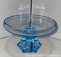oblique view of blue glass dish showing bowl and pedestal