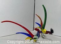 Both glass roosters side view showing size and colours