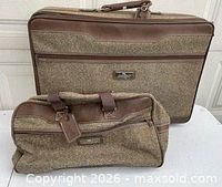 Large and small Jordache tweed suitcases front view