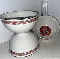 Two stacked Lenox Soda Shop Sweethearts bowls showing exterior checkerboard border