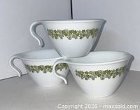 Three Corelle Spring Blossom Green hook-handle cups, front and side view