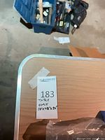 Lot overview showing laminate top with metal edge and folding legs