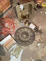 Group shot showing round ceiling canopy, sink with faucet, sconce arm, mail slot plates