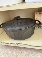 Dutch oven with lid on shelf