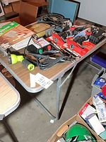Top view of folding table with tools and accessories displayed