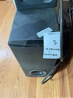 LG powered subwoofer front and side view